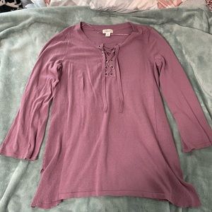 Purple sweater. Quarter length sleeves. Larger than a medium